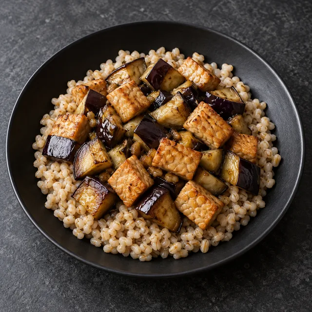 Illustrative serving of Tempeh & Barley With Eggplant